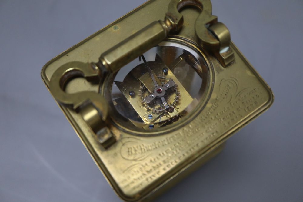 A late 19th century brass carriage timepiece, engraving to the top plate